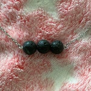 Silver tone, lava bead necklace, approximately 18 inches plus extendable